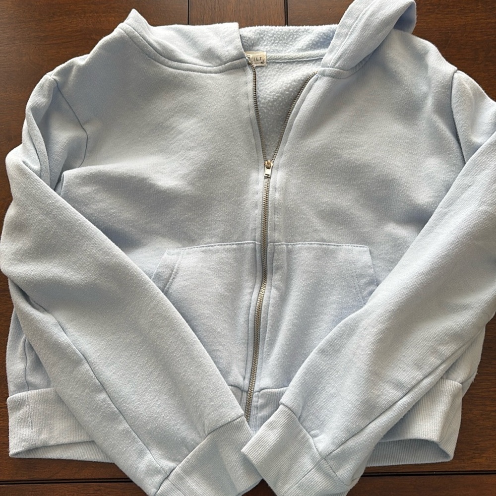 Baby blue full tilt cropped zip up jacket. Size: xl kids. Color: baby blue